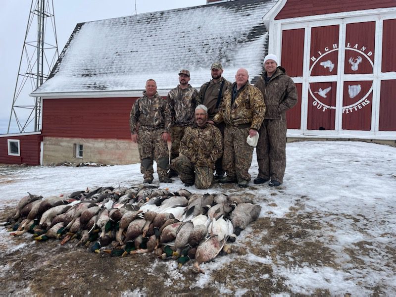 hunters with waterfowl in fall